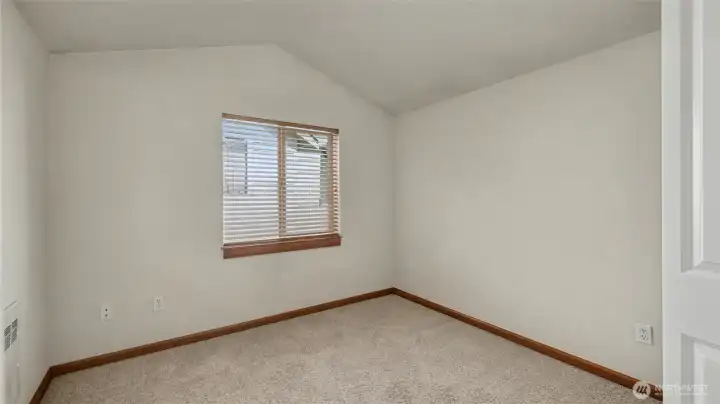 Second bedroom with vaulted ceilings.