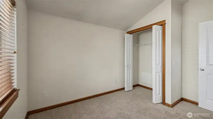 Second bedroom with vaulted ceilings.