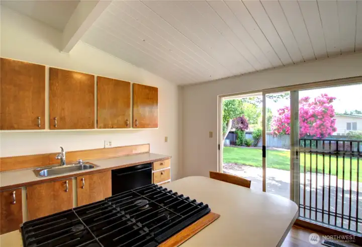 The kitchen has an oversized slider leading out to the back patio.