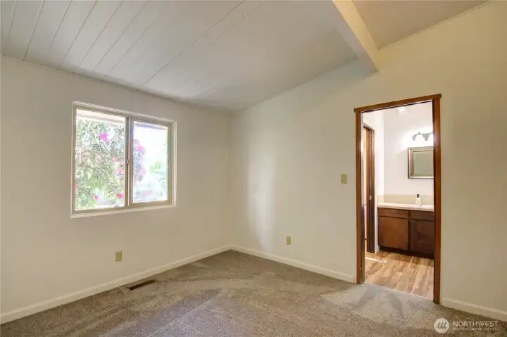 The first of three bedrooms on the east side of the home. This bedroom has direct access to the shared full bathroom.