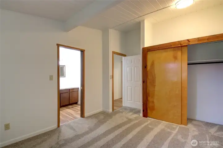 The first bedroom with bathroom access. A view back to the closet and bedroom door.