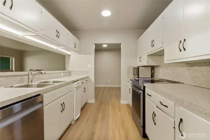 Kitchen has been updated with new floor, counter tops sink faucet, garbage disposal and appliances. Kitchen has been updated with new floor, counter tops sink faucet, garbage disposal and appliances.
