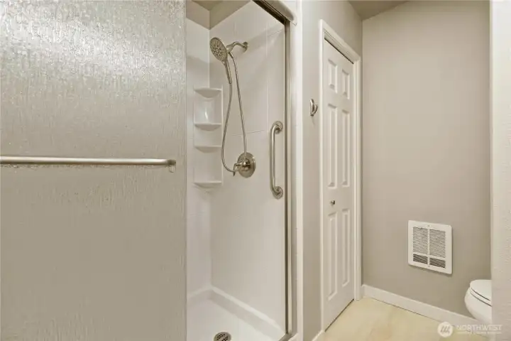 Primary bath with new shower surround and new toilet. Primary bath with new shower surround and new toilet.