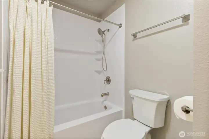 Guest bath with new tub surround and new toilet. Guest bath with new tub surround and new toilet.
