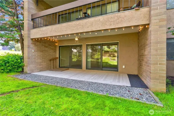 Out door covered patio with two sliders conveniently located from the living room. Out door covered patio with two sliders conveniently located from the living room.