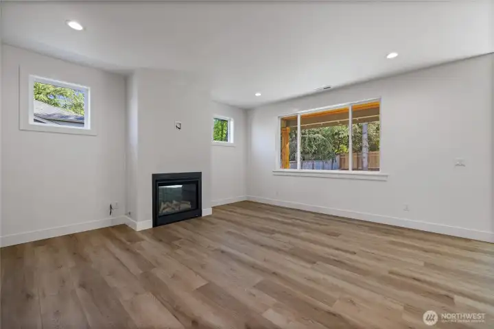 spacious living room with a cozy gas fireplece