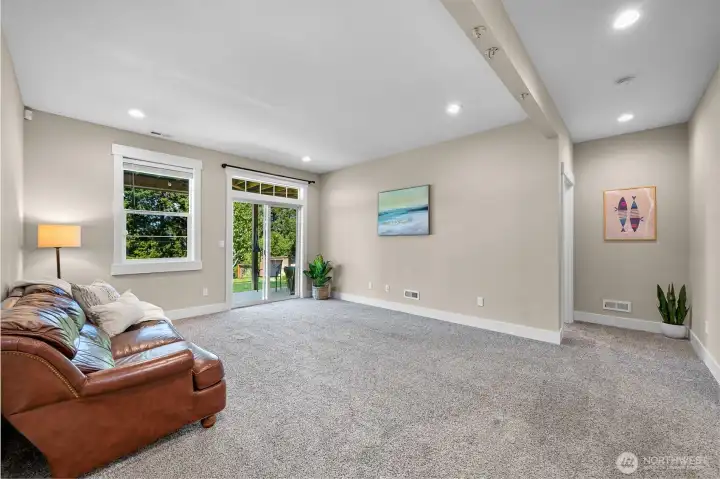 The lower level of the house is made for fun and versatility. Could easily be made into a MIL suite with a kitchenette already installed, perfect for multi-generational living. Or maybe a movie room or kids rec room? You will find two more bedrooms downstairs, a full bathroom and a bonus room that is currently being used as a home gym.