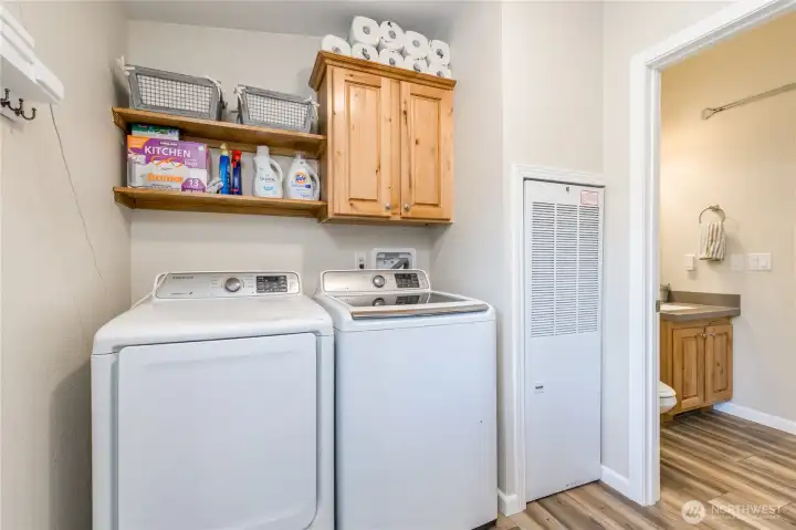 Laundry/mudroom is centrally located between the kitchen and hall bath. Laundry/mudroom is centrally located between the kitchen and hall bath.