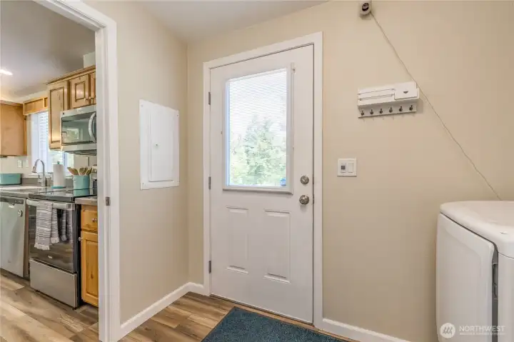 Mudroom has side door to the primary parking area. Mudroom has side door to the primary parking area.