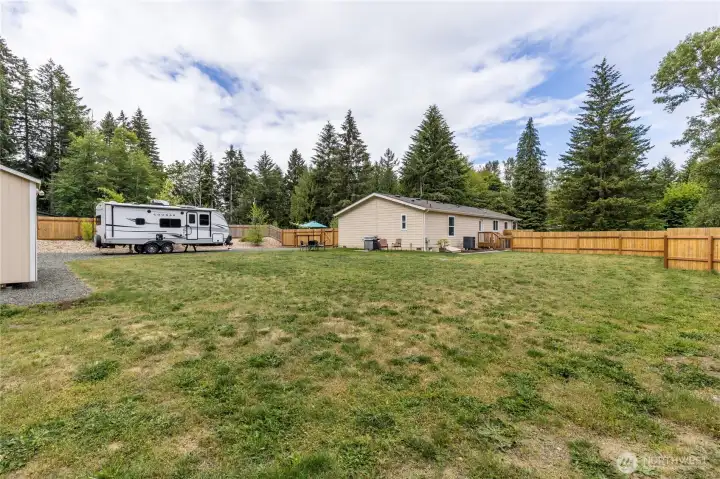 Gated, paved RV parking area with power hookup can accommodate a full-size rig or multiple vehicles. Or add your own carport, garage or shop! Gated, paved RV parking area with power hookup can accommodate a full-size rig or multiple vehicles. Or add your own carport, garage or shop!