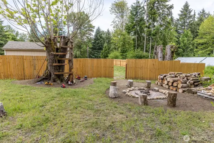 Your own private campground: Enjoy cozy evenings around the firepit and endless outdoor adventures with the custom treehouse and play area. Your own private campground: Enjoy cozy evenings around the firepit and endless outdoor adventures with the custom treehouse and play area.