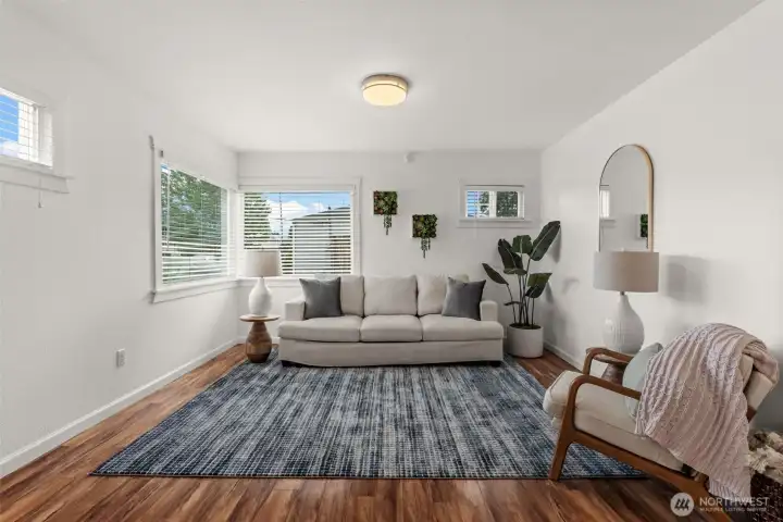Bright, airy, and beautifully efficient. The main living space maximizes every square foot with optimal window placement, creating a warm and inviting hub. Bright, airy, and beautifully efficient. The main living space maximizes every square foot with optimal window placement, creating a warm and inviting hub.
