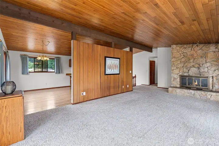 Natural warmth from vaulted ceilings in the Living Room looking back toward entry