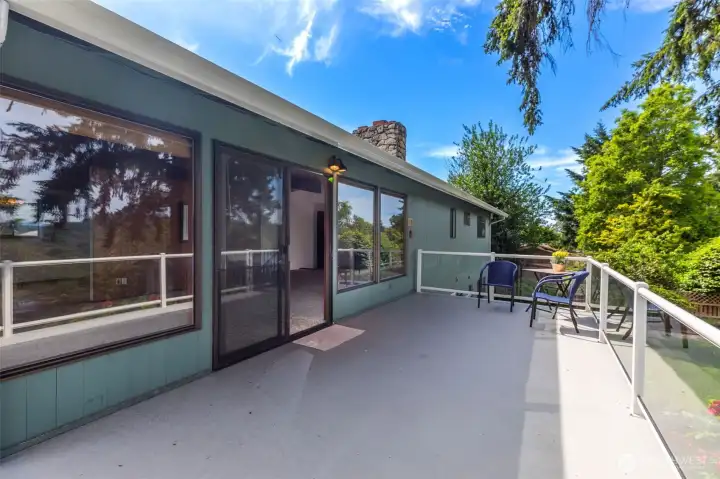 Deck off living room with stairs to back yard