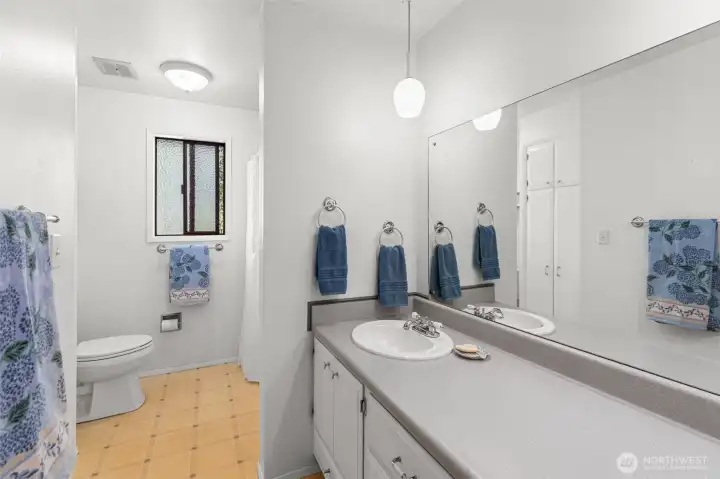 Main level Full Bathroom w/ Laundry chute down to laundry room