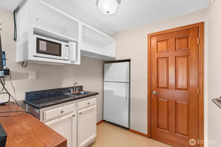 Kitchenette and storage just off of Family Room next to Garage Access