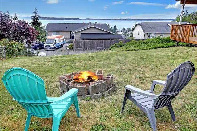 Large yard with bon fire pit and below parking.