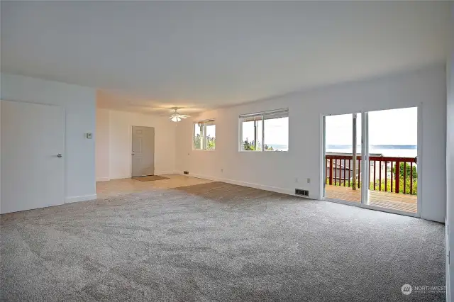 Great room with huge slider to large, entertaining deck and back yard.