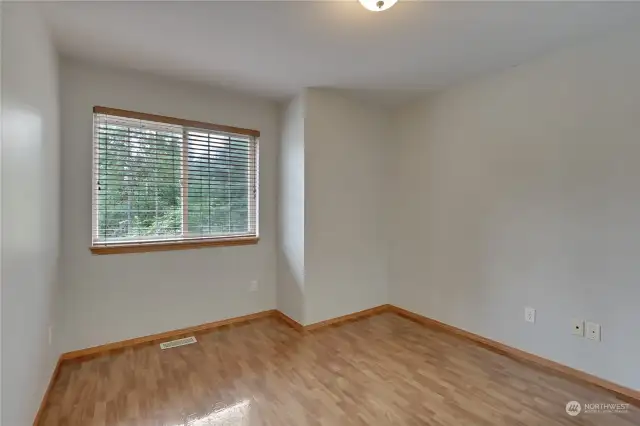 First spare bedroom on the second floor that is very spacious and gas stunning hard wood floors.