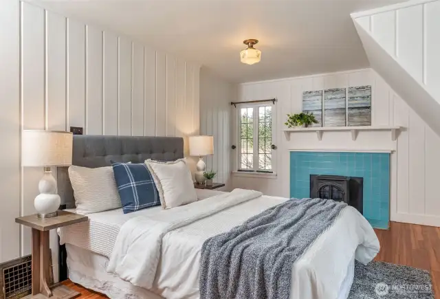 Upstairs primary BR with Fireplace.