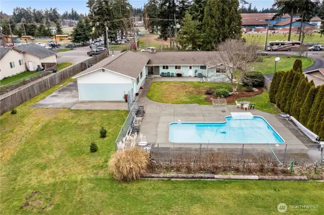 In-ground pool is heated, includes all pool supplies with purchase of home.