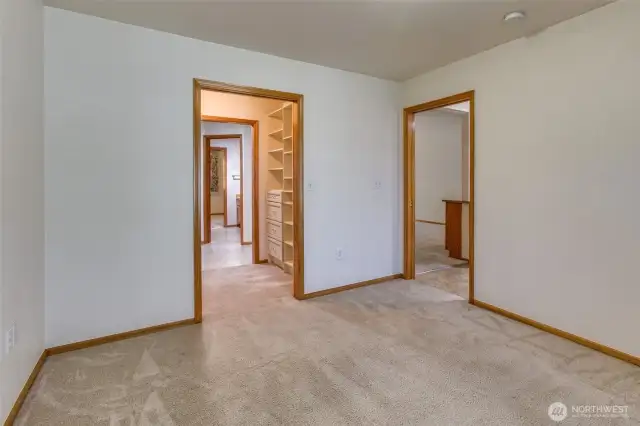 Large primary bedroom with pocket doors for increased accesibility.