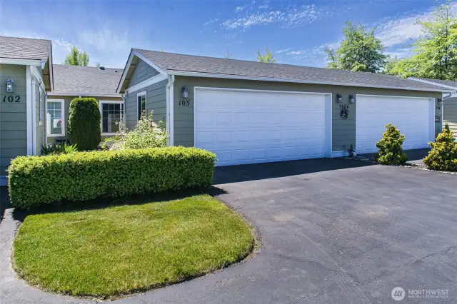 Driveway parking and spacious two car garage perfect for extra storage.