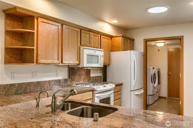 Peep the laundry/mud room just off the kitchen that leads to the garage.