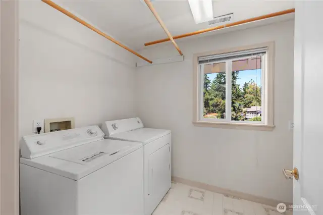 Laundry room on upper floor with bedrooms