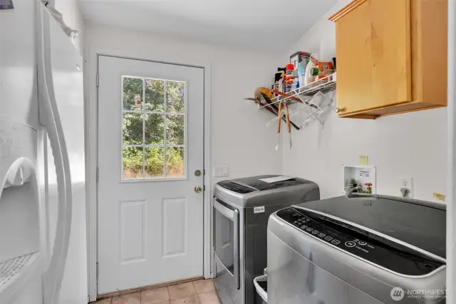 Laundry room with access to backyard. Washer/dryer stay plus 2nd refrigerator.