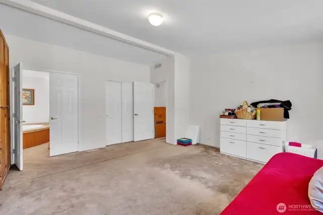 Primary bedroom with private bath and walk in closet.