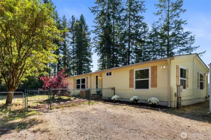 Nestled on a private, nearly 5-acre parcel with stunning territorial views, this beautifully updated 3-bedroom, 2-bathroom home offers the perfect blend of modern comfort and natural beauty.