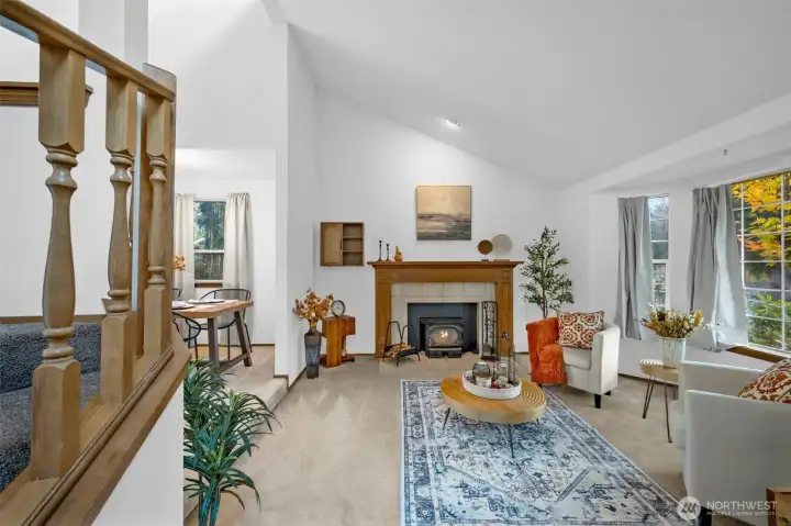 Step into the front living room with fireplace.
