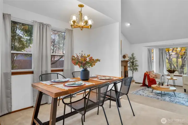Bright windows leading out to the side yard and sightlines into the living room.