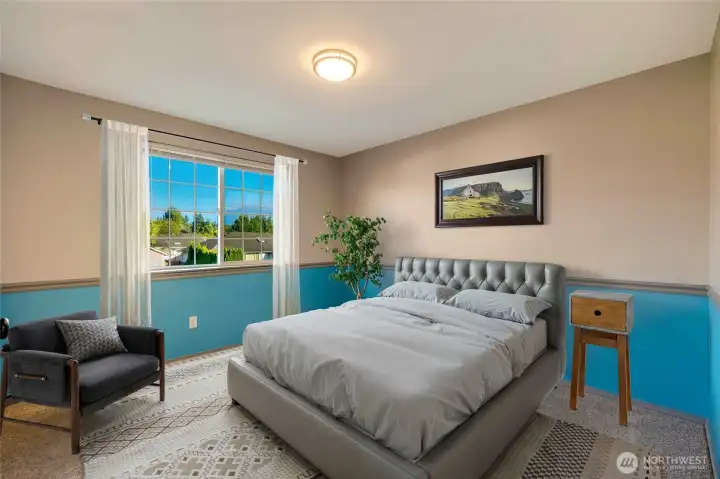 Two generously sized additional bedrooms on the main floor are perfect for children, guests, or a home office.