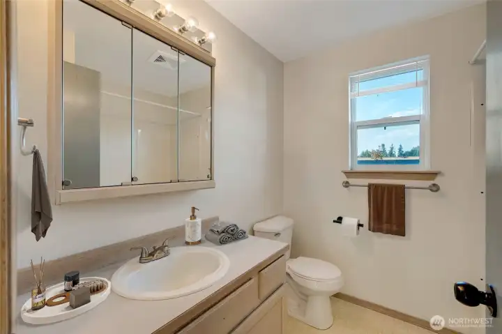 They share a full bath, thoughtfully designed to combine style and functionality.