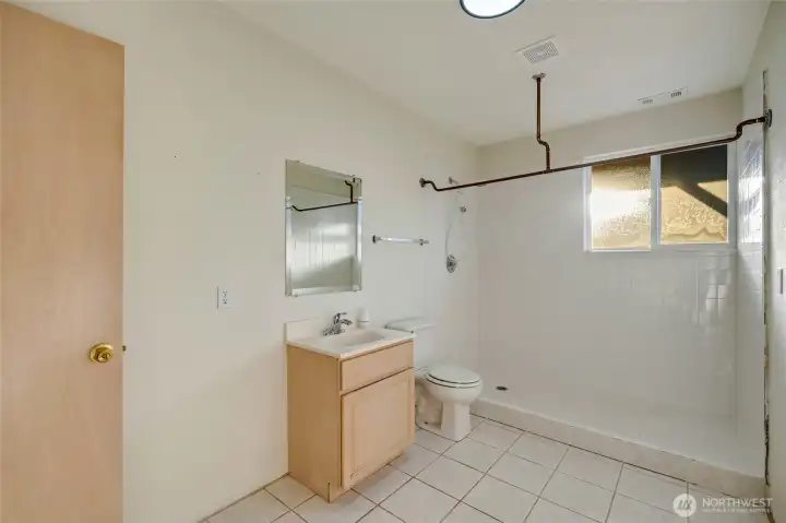A nearby ¾ bath provides convenience without sacrificing privacy.