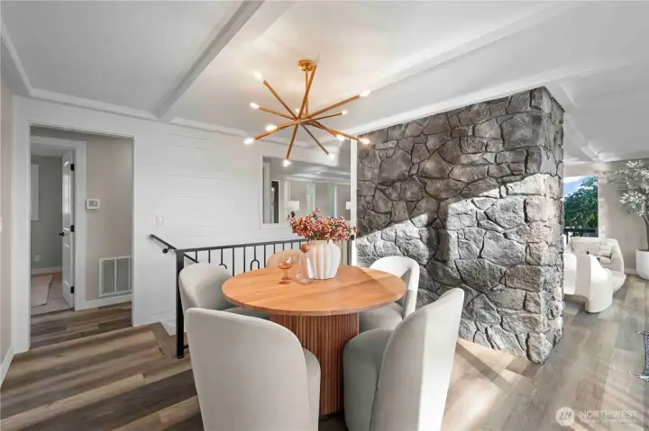 Custom white shiplap accent down stairway in dinning room