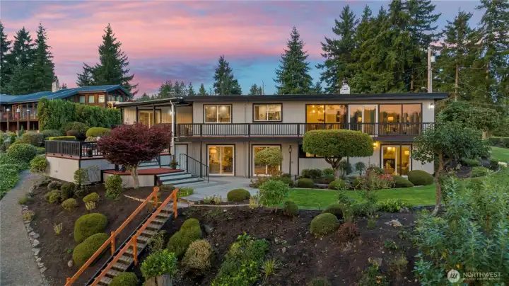 Mature landscaping, view of 130' ft of water front.