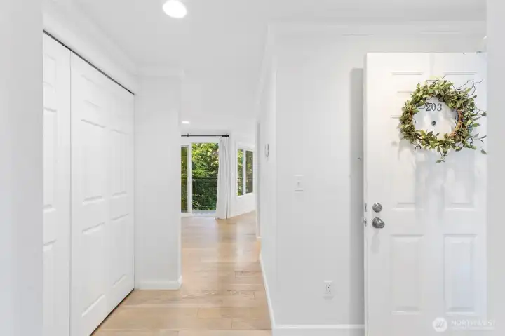 Slightlines to the living area with a lush green space offering privacy behind the condo.