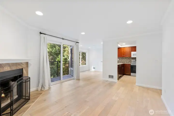 The living, dining, and kitchen areas work seamlessly together whether you're hosting or just enjoying a night at home.