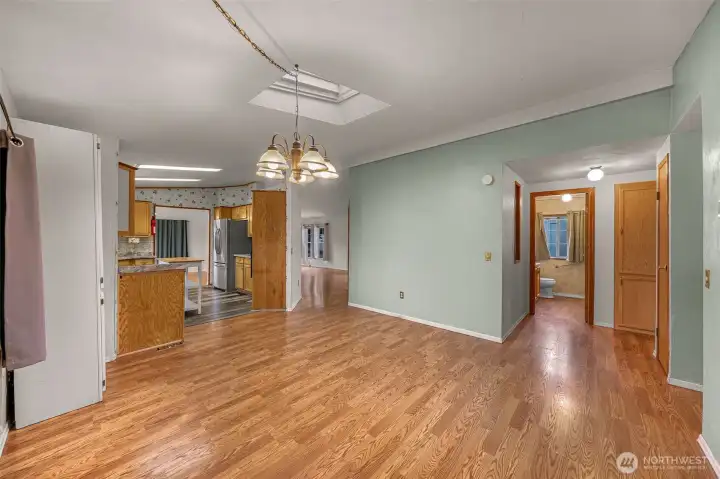 Great room looking into kitchen and hallway bathroom