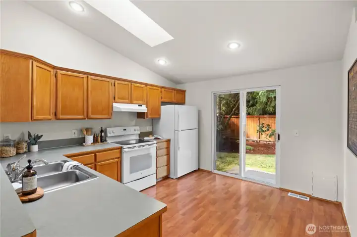 With sliding door to the back yard, this kitchen has a ton of light