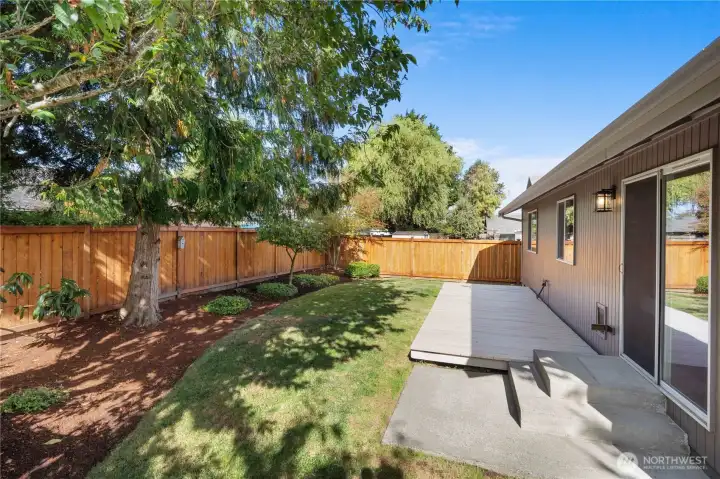 The perfect little back yard.  Nice deck for entertaining but just enough space to have green but not spend the weekend mowing!