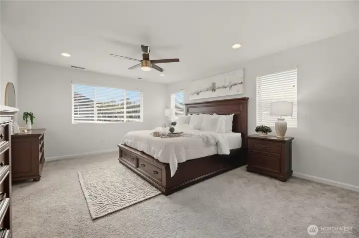Large primary bedroom features French door entry