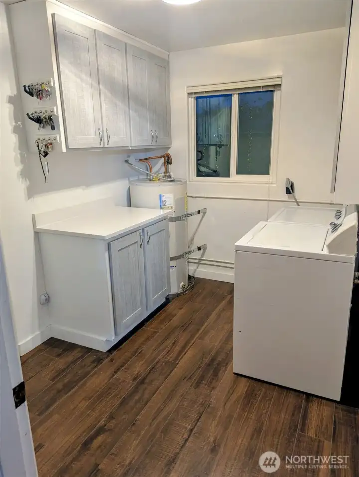 Remodeled utility room with additional cabinets added.