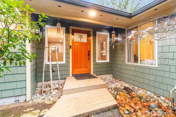 Entrance with solid wood door.