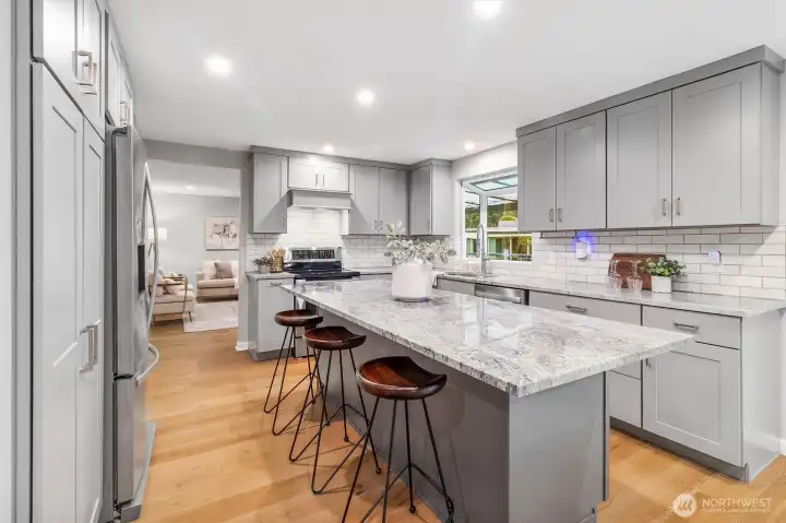 Remodeled kitchen with granite countertops.