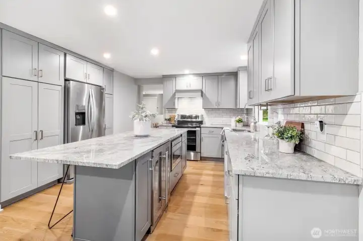 Island with Sharp microwave and bar fridge.