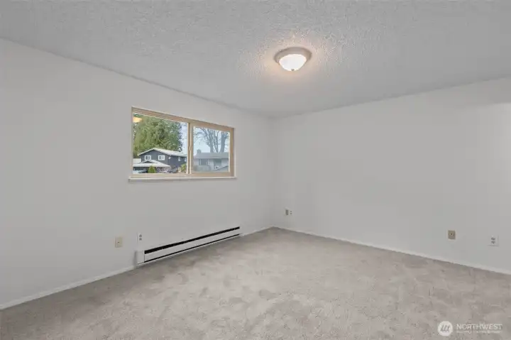 Spacious Primary BR has 3/4 Bath and west-facing window.